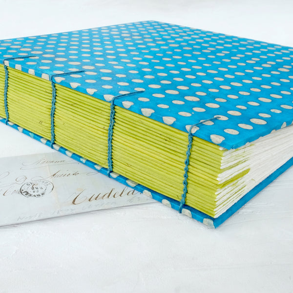 blue and lime spot-coptic-album-spine guards-exposed stitch-handmade-the idle bindery